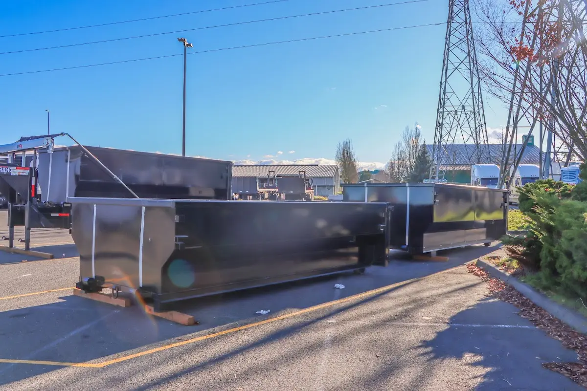 Roll-off dumpster ready for waste disposal at job site for Concrete Dumpster Rental in Walla Walla